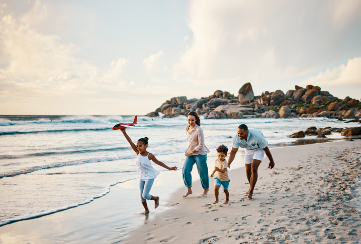 Family on the beach playing